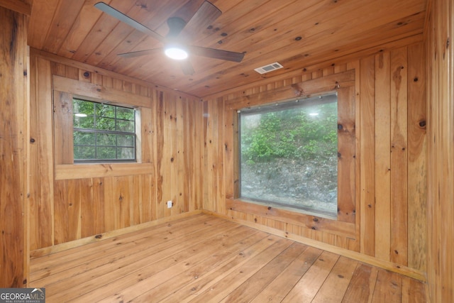853 Bates Rd, Ellijay, GA 30540 - empty room featuring a ceiling fan, wooden walls, hardwood / wood-style floors, and wood ceiling