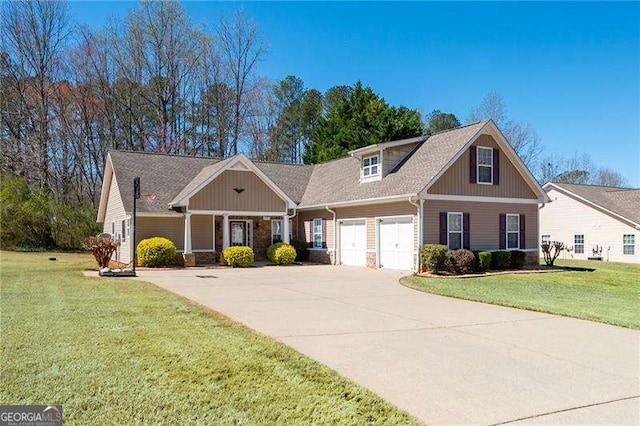 85 Stiles Dr, Dallas, GA 30132 - craftsman house featuring a front lawn, driveway, board and batten siding, stone siding, and an attached garage