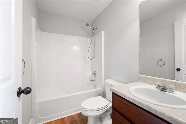 85 Stiles Dr, Dallas, GA 30132 - full bath featuring vanity, washtub / shower combination, and wood finished floors