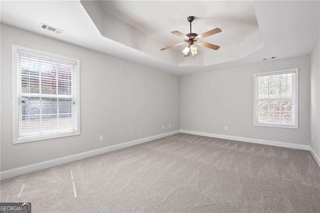 85 Stiles Dr, Dallas, GA 30132 - empty room with a tray ceiling, ceiling fan, and carpet