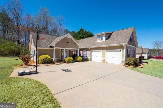 85 Stiles Dr, Dallas, GA 30132 - craftsman house featuring concrete driveway, a front yard, an attached garage, stone siding, and a shingled roof