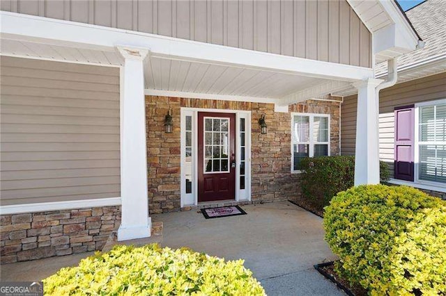 85 Stiles Dr, Dallas, GA 30132 - entrance to property with stone siding, covered porch, and board and batten siding