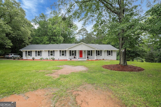 3290 Ebenezer Rd SE, Conyers, GA 30094 - single story home featuring a porch, a front lawn, and view of wooded area