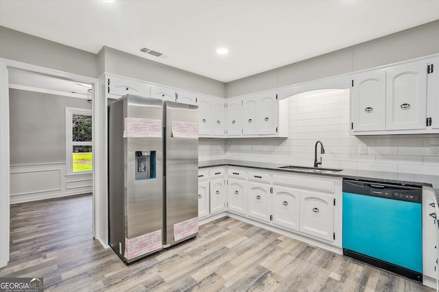 3290 Ebenezer Rd SE, Conyers, GA 30094 - kitchen with stainless steel refrigerator with ice dispenser, dishwasher, a sink, light wood-style flooring, and white cabinetry