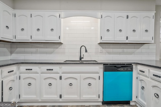 3290 Ebenezer Rd SE, Conyers, GA 30094 - kitchen with dishwashing machine, a sink, decorative backsplash, and white cabinets