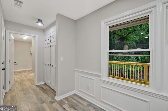3290 Ebenezer Rd SE, Conyers, GA 30094 - hallway featuring light wood-style floors and baseboards