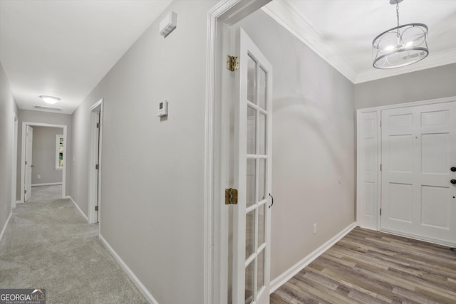 3290 Ebenezer Rd SE, Conyers, GA 30094 - hall featuring baseboards, a chandelier, and crown molding