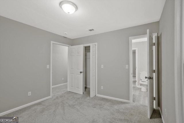 3290 Ebenezer Rd SE, Conyers, GA 30094 - unfurnished bedroom featuring carpet, baseboards, and a spacious closet