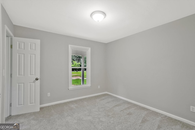 3290 Ebenezer Rd SE, Conyers, GA 30094 - spare room featuring carpet and baseboards