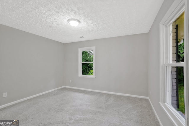 3290 Ebenezer Rd SE, Conyers, GA 30094 - carpeted empty room with baseboards and a textured ceiling