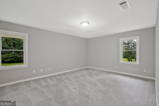 3290 Ebenezer Rd SE, Conyers, GA 30094 - carpeted spare room featuring plenty of natural light and baseboards