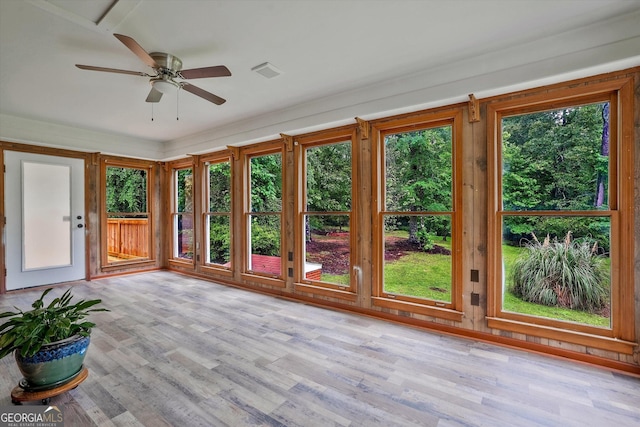 3290 Ebenezer Rd SE, Conyers, GA 30094 - unfurnished sunroom with wood finished floors