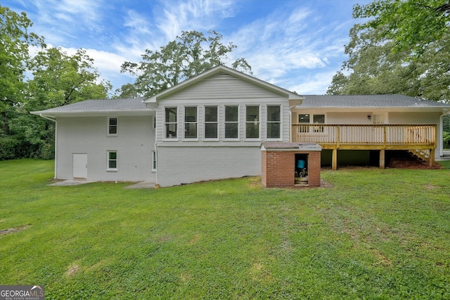 3290 Ebenezer Rd SE, Conyers, GA 30094 - rear view of house featuring a deck, a yard, and brick siding