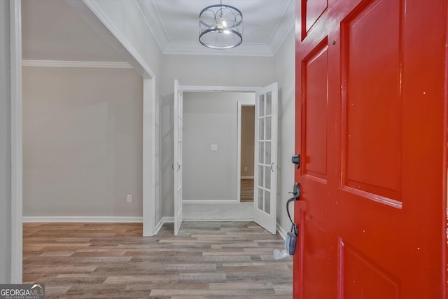 3290 Ebenezer Rd SE, Conyers, GA 30094 - foyer entrance featuring wood finished floors, ornamental molding, and baseboards