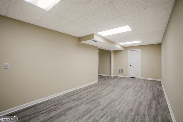 3290 Ebenezer Rd SE, Conyers, GA 30094 - finished basement with a paneled ceiling, wood finished floors, and baseboards