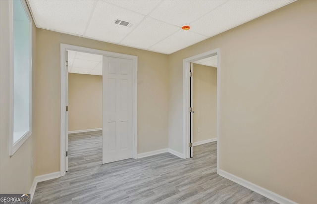 3290 Ebenezer Rd SE, Conyers, GA 30094 - unfurnished bedroom featuring wood finished floors, a drop ceiling, baseboards, and a closet