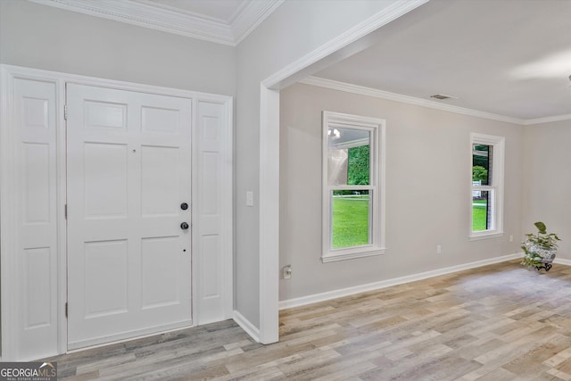 3290 Ebenezer Rd SE, Conyers, GA 30094 - entryway featuring light wood finished floors, crown molding, and baseboards