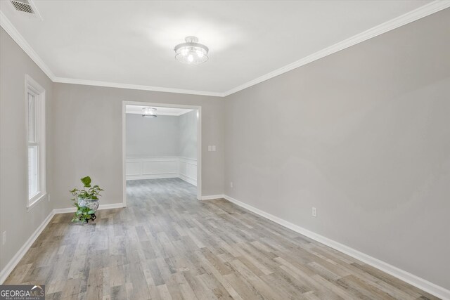 3290 Ebenezer Rd SE, Conyers, GA 30094 - empty room with wood finished floors, crown molding, and baseboards