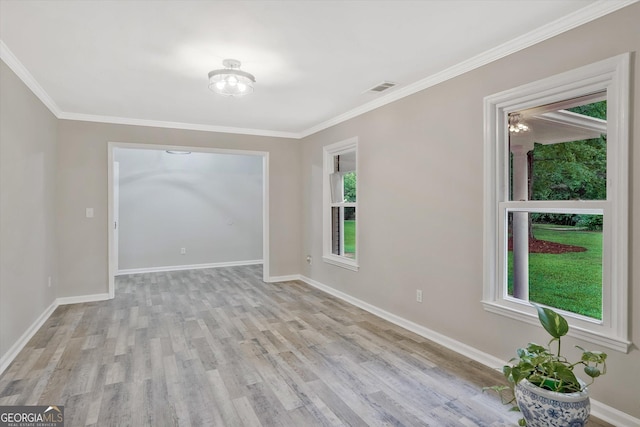 3290 Ebenezer Rd SE, Conyers, GA 30094 - empty room featuring plenty of natural light, light wood-type flooring, baseboards, and crown molding