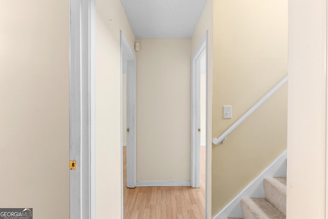 3599 Salem Glen Rd, Lithonia, GA 30038 - hall with wood finished floors, baseboards, and stairs
