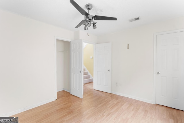 3599 Salem Glen Rd, Lithonia, GA 30038 - unfurnished bedroom featuring light wood-style flooring, baseboards, a closet, and ceiling fan