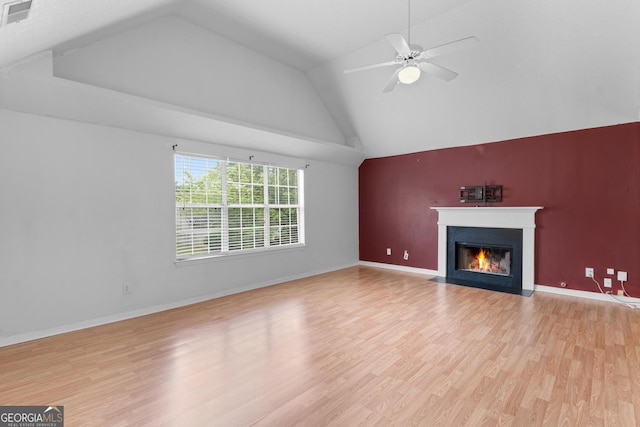 3599 Salem Glen Rd, Lithonia, GA 30038 - unfurnished living room with a fireplace with flush hearth, light wood-style flooring, ceiling fan, high vaulted ceiling, and baseboards