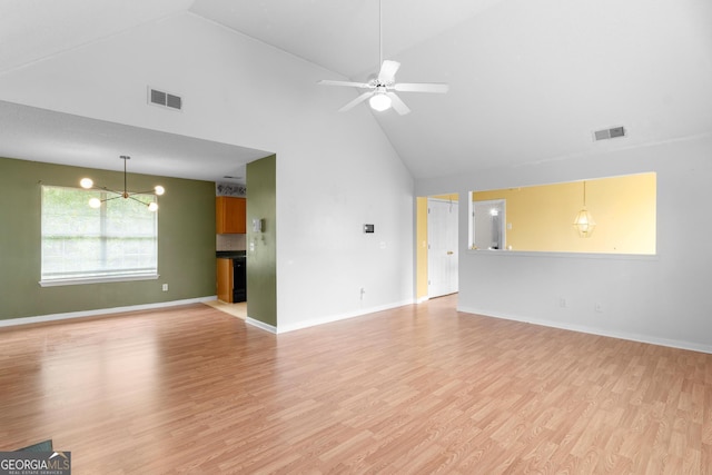 3599 Salem Glen Rd, Lithonia, GA 30038 - unfurnished living room with high vaulted ceiling, a chandelier, light wood-style flooring, baseboards, and a ceiling fan