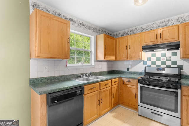 3599 Salem Glen Rd, Lithonia, GA 30038 - kitchen with stainless steel gas range oven, black dishwasher, under cabinet range hood, a sink, and dark countertops