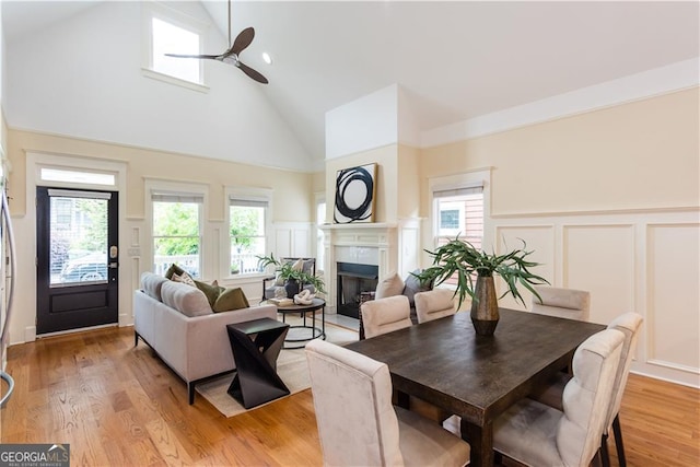 151 Savannah St SE, Atlanta, GA 30316 - dining area featuring a decorative wall, high vaulted ceiling, a fireplace, a ceiling fan, and wainscoting