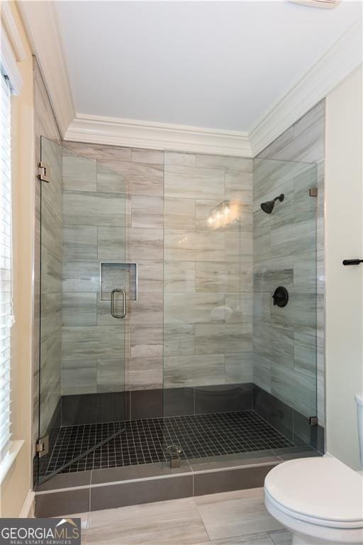 151 Savannah St SE, Atlanta, GA 30316 - full bathroom featuring ornamental molding, toilet, a stall shower, tile patterned floors, and healthy amount of natural light
