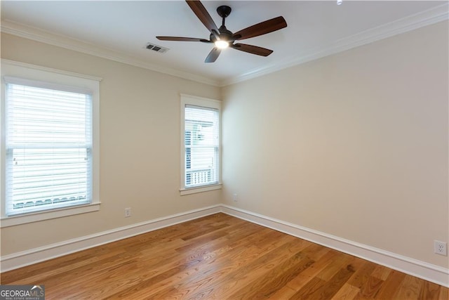 151 Savannah St SE, Atlanta, GA 30316 - empty room with light wood-style flooring, a ceiling fan, ornamental molding, and baseboards