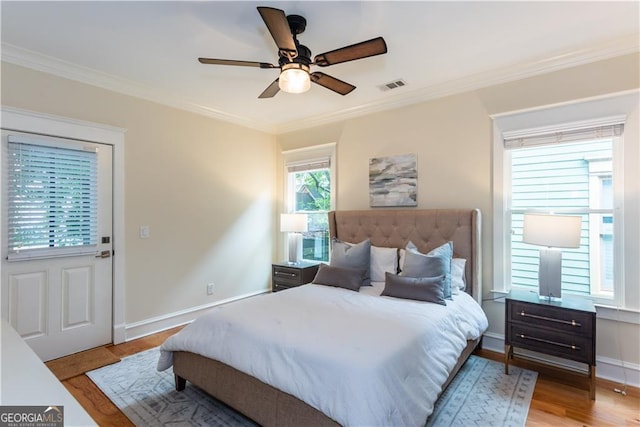 151 Savannah St SE, Atlanta, GA 30316 - bedroom featuring crown molding, light wood-style flooring, baseboards, and a ceiling fan