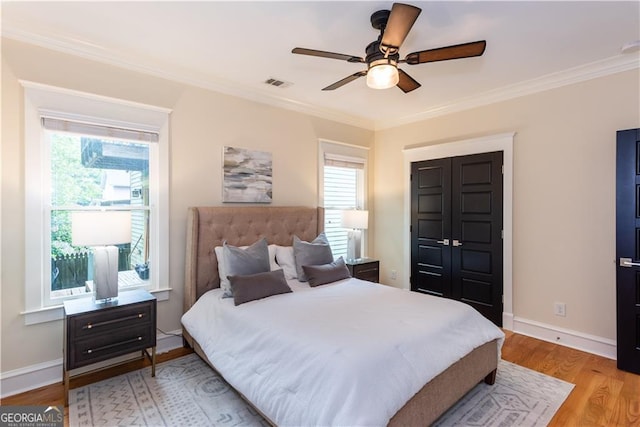 151 Savannah St SE, Atlanta, GA 30316 - bedroom with multiple windows, ornamental molding, light wood-type flooring, and baseboards