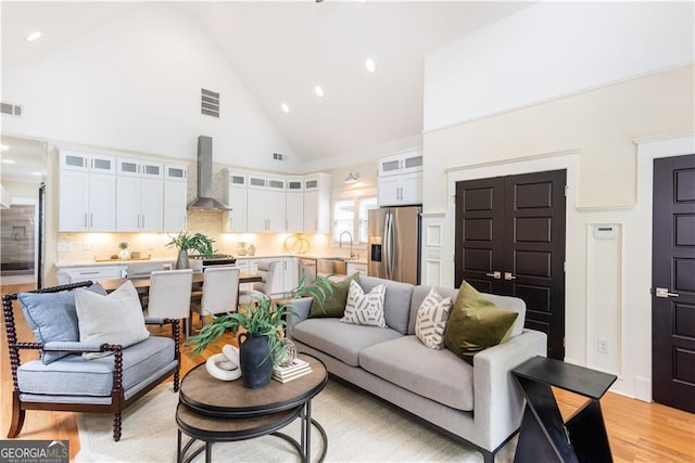 151 Savannah St SE, Atlanta, GA 30316 - living room featuring high vaulted ceiling, light wood-type flooring, and recessed lighting