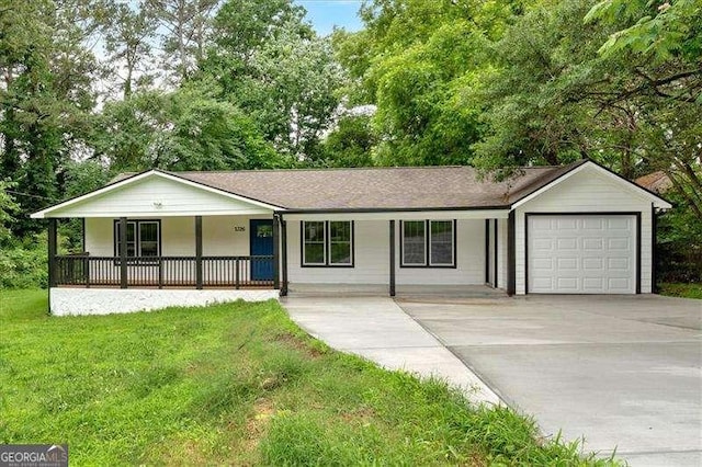 2326 Brackett St SW, Marietta, GA 30060 - single story home featuring a porch, a garage, a front yard, and concrete driveway