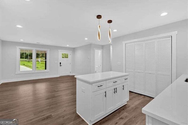 2326 Brackett St SW, Marietta, GA 30060 - kitchen with dark wood-type flooring, white cabinetry, open floor plan, light countertops, and recessed lighting