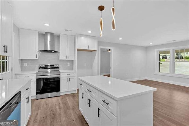 2326 Brackett St SW, Marietta, GA 30060 - kitchen with stainless steel electric stove, wall chimney range hood, dishwashing machine, light wood-style flooring, and light countertops