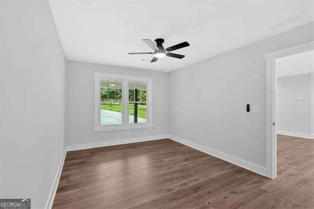 2326 Brackett St SW, Marietta, GA 30060 - unfurnished room featuring a ceiling fan, baseboards, and dark wood-type flooring