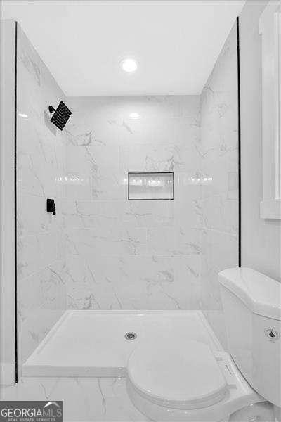 2326 Brackett St SW, Marietta, GA 30060 - bathroom featuring marble finish flooring, toilet, a marble finish shower, and recessed lighting
