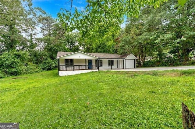 2326 Brackett St SW, Marietta, GA 30060 - view of front of property featuring covered porch, a front yard, and driveway