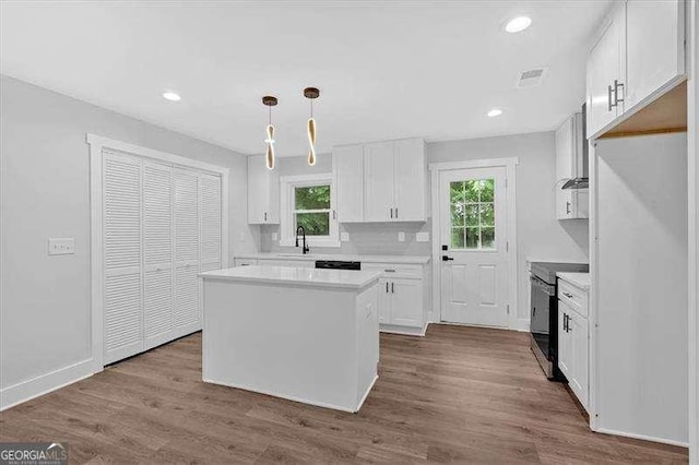2326 Brackett St SW, Marietta, GA 30060 - kitchen with white cabinets, healthy amount of natural light, light countertops, and recessed lighting