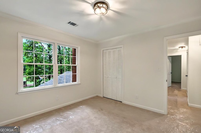 3564 Liberty Ln, Marietta, GA 30062 - unfurnished bedroom featuring ornamental molding, baseboards, a closet, and carpet floors