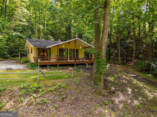 115 Jin Ln, Franklin, NC 28734 - view of front of home with a wooded view and a deck