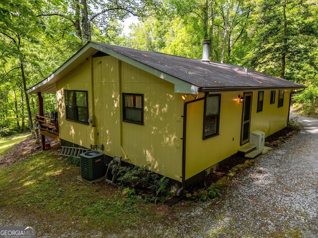 115 Jin Ln, Franklin, NC 28734 - view of side of property with central AC and roof with shingles