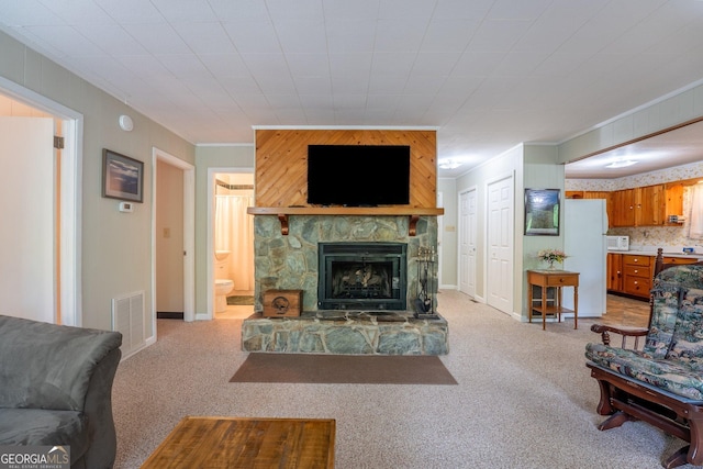 115 Jin Ln, Franklin, NC 28734 - living room with crown molding, light colored carpet, and a fireplace