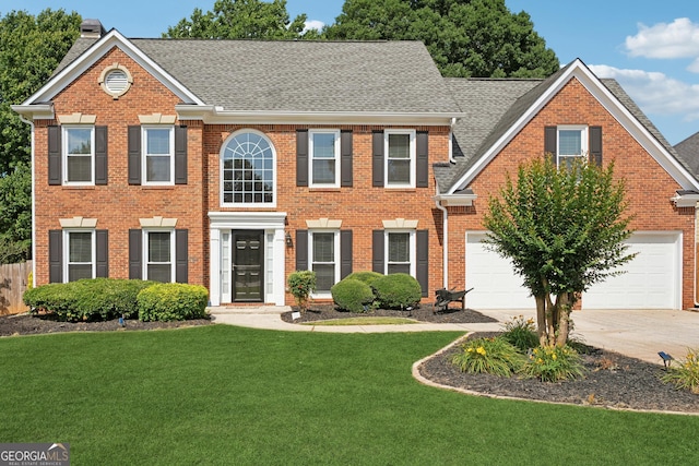 75 Hunters Ct, Dallas, GA 30157 - colonial home with brick siding, concrete driveway, roof with shingles, and a front yard