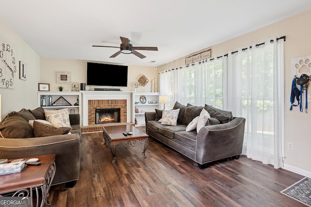 75 Hunters Ct, Dallas, GA 30157 - living area with ceiling fan, dark wood-type flooring, and a brick fireplace