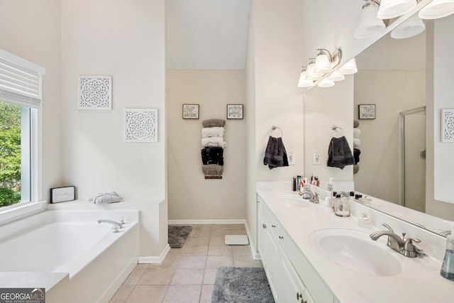 75 Hunters Ct, Dallas, GA 30157 - bathroom with a garden tub, double vanity, a shower stall, tile patterned flooring, and baseboards