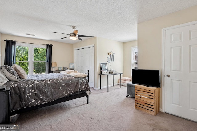75 Hunters Ct, Dallas, GA 30157 - carpeted bedroom with a closet, ceiling fan, and a textured ceiling