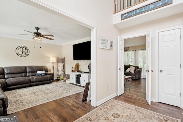 75 Hunters Ct, Dallas, GA 30157 - living area featuring dark wood-style flooring, a ceiling fan, crown molding, and baseboards